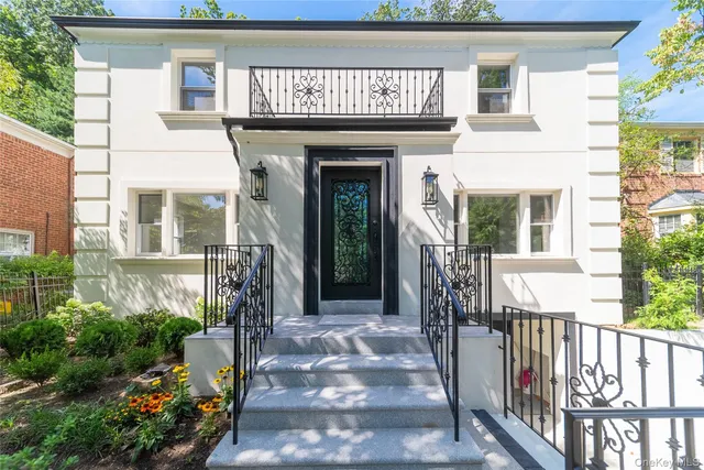 a front view of a house with a porch