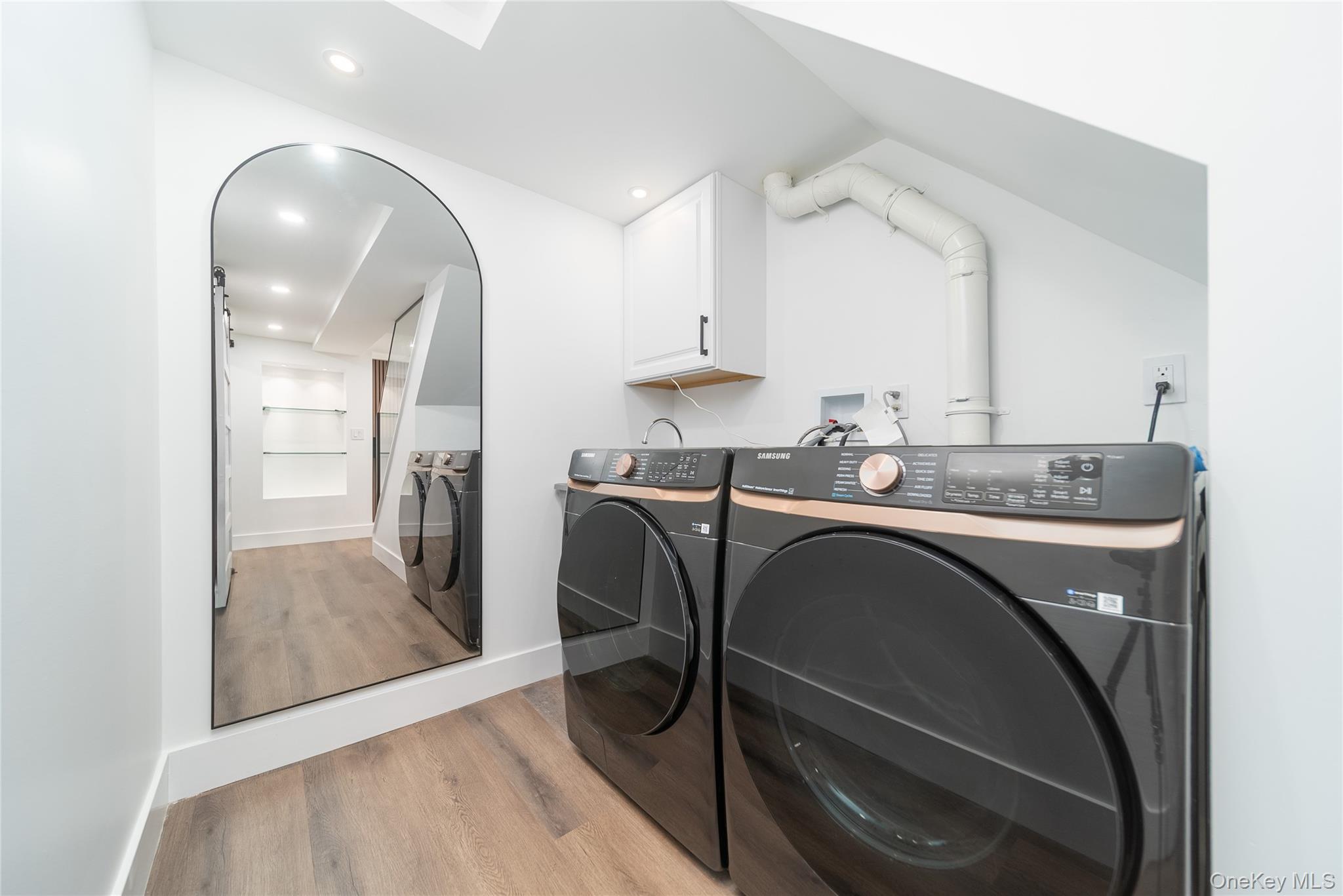 86-32 Midland Parkway Queens, NY 11432 - Photo 20 of 26 a kitchen with a table chairs sink and cabinets