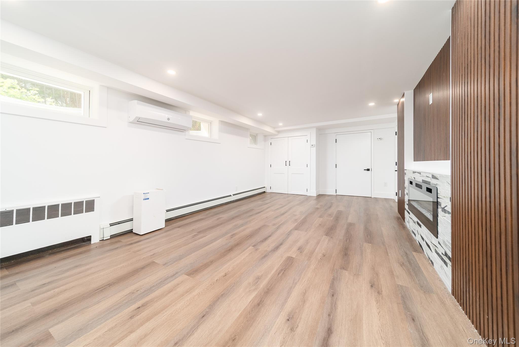 86-32 Midland Parkway Queens, NY 11432 - Photo 21 of 26 a view of empty room with wooden floor