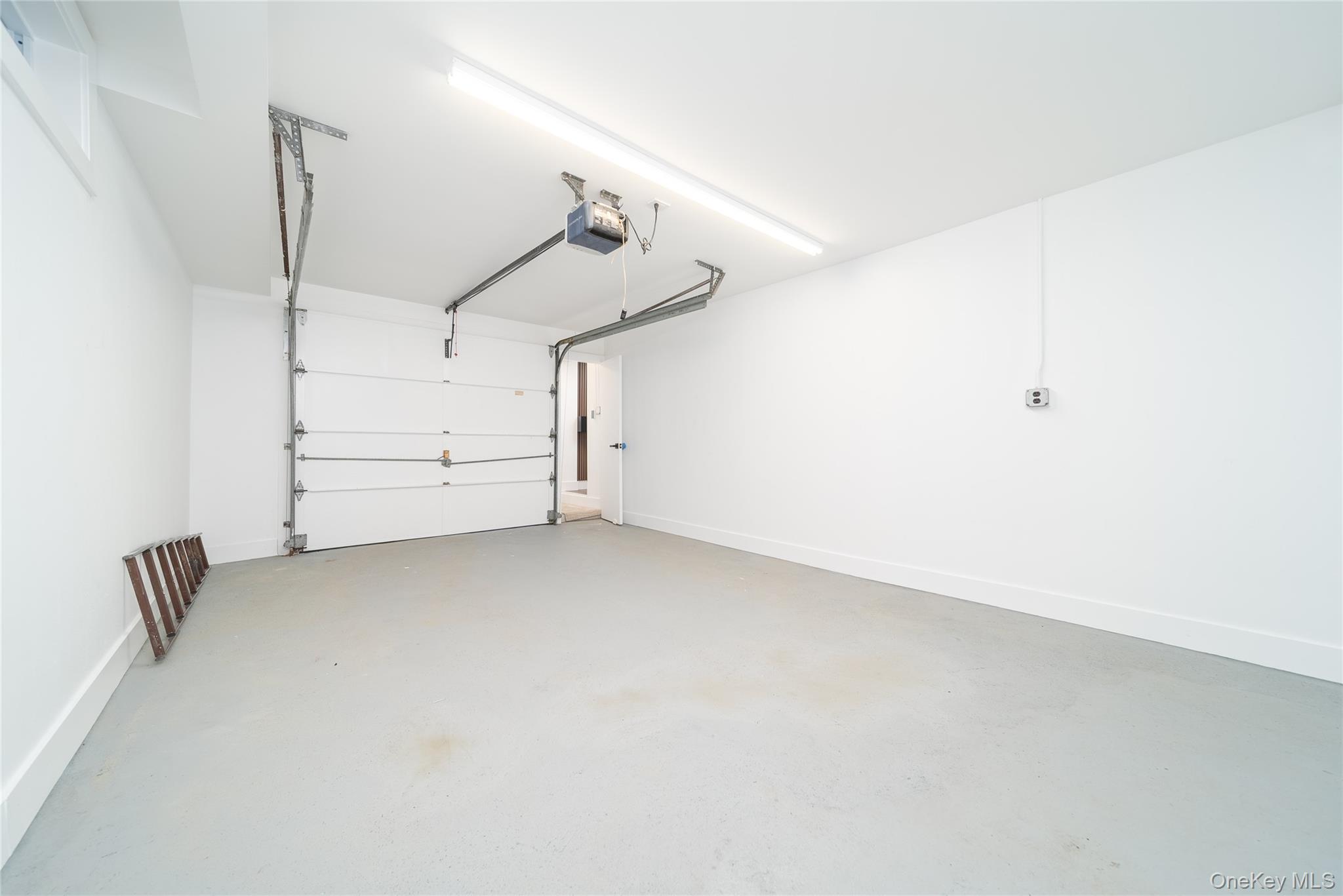 86-32 Midland Parkway Queens, NY 11432 - Photo 22 of 26 a view of room with stairs and a ceiling fan