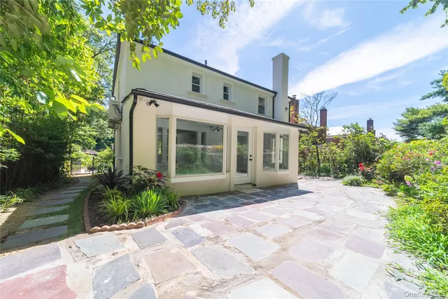a view of a house with a yard and plants