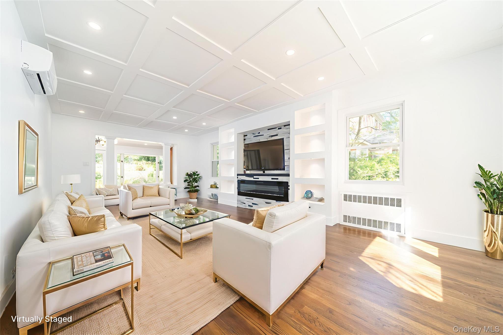 86-32 Midland Parkway Queens, NY 11432 - Photo 4 of 26 a living room with furniture wooden floor and a flat screen tv