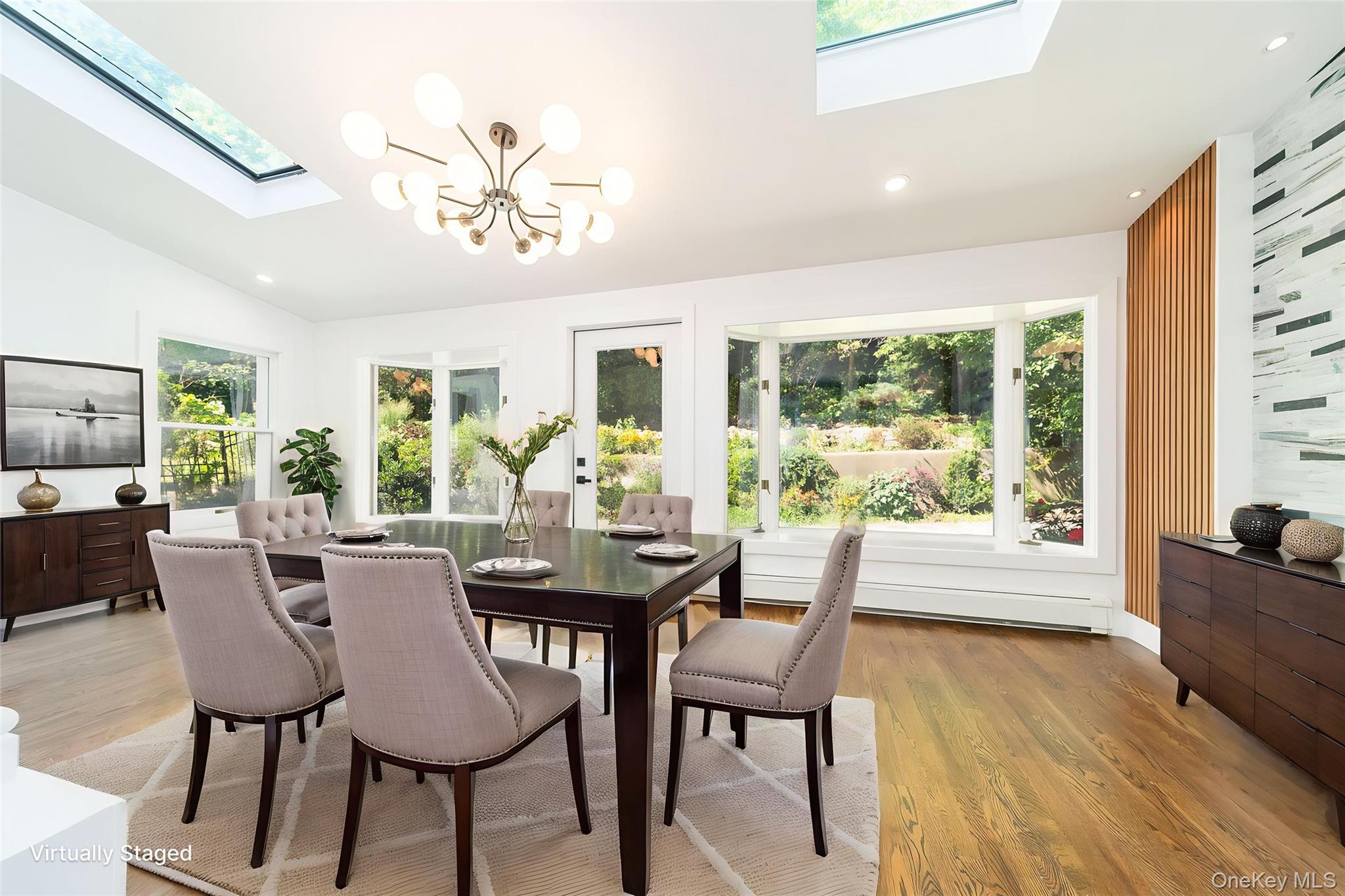 86-32 Midland Parkway Queens, NY 11432 - Photo 5 of 26 a view of a dining room with furniture window and wooden floor