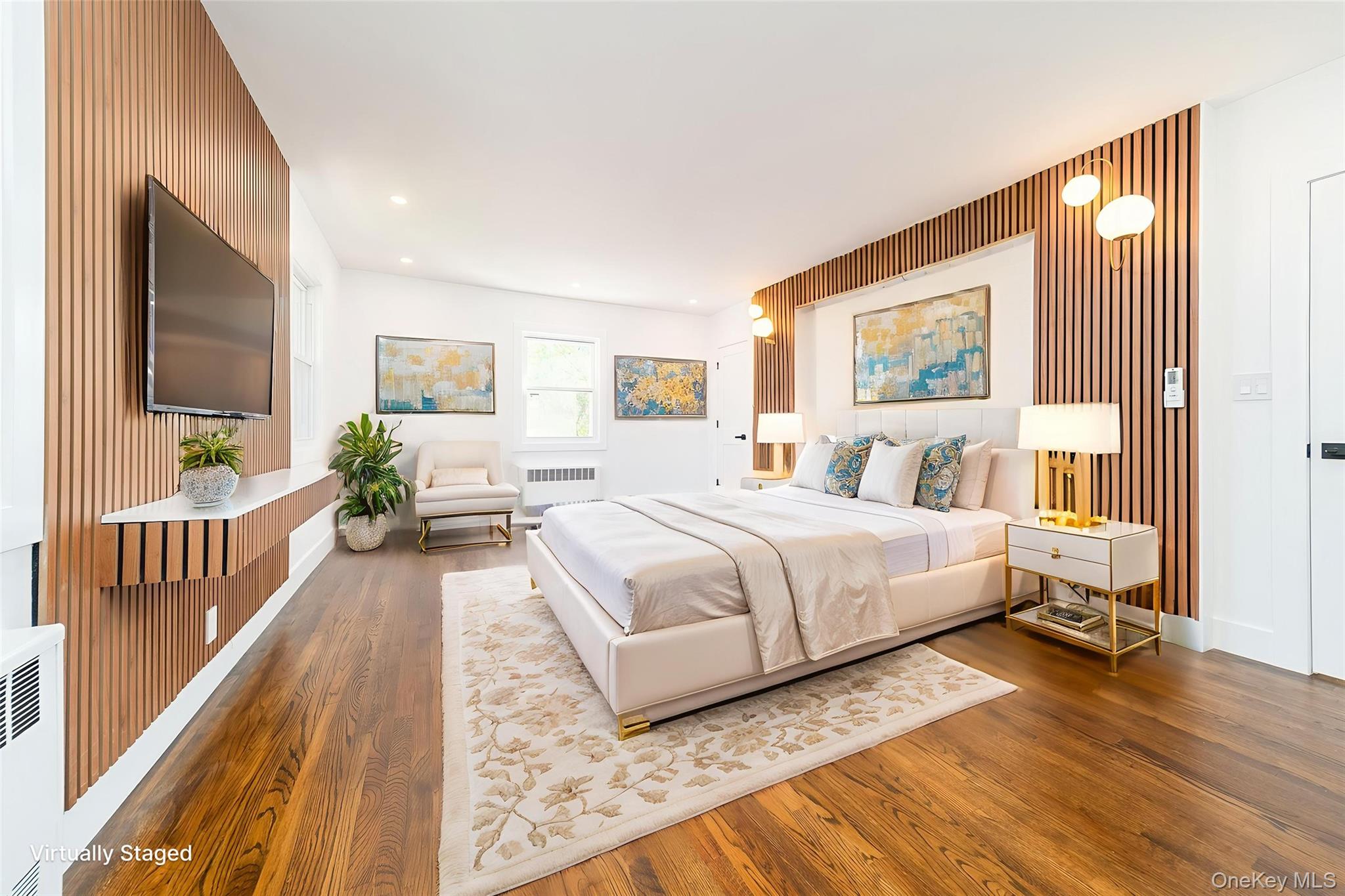 86-32 Midland Parkway Queens, NY 11432 - Photo 6 of 26 a bedroom with a bed and a flat screen tv