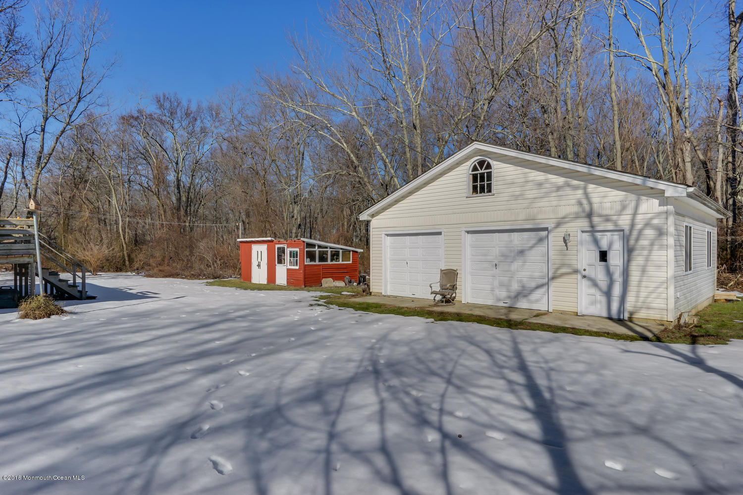 351 Iron Ore Road Manalapan, NJ 07726 - Photo 17 of 20 a front view of a house with a yard