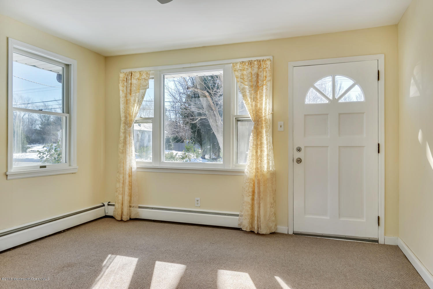 351 Iron Ore Road Manalapan, NJ 07726 - Photo 4 of 20 a view of an empty room with a window