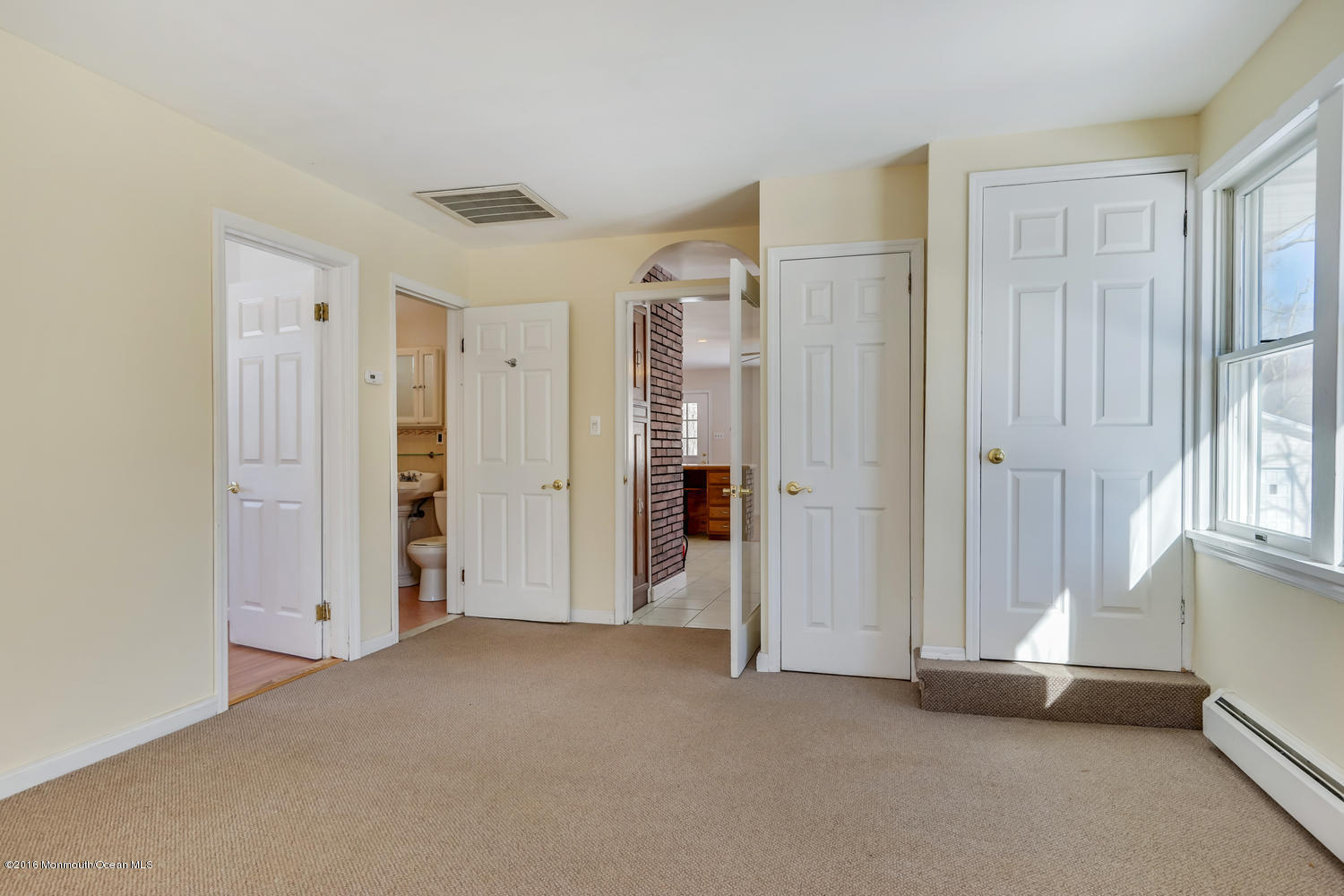 351 Iron Ore Road Manalapan, NJ 07726 - Photo 6 of 20 a view of empty room with windows