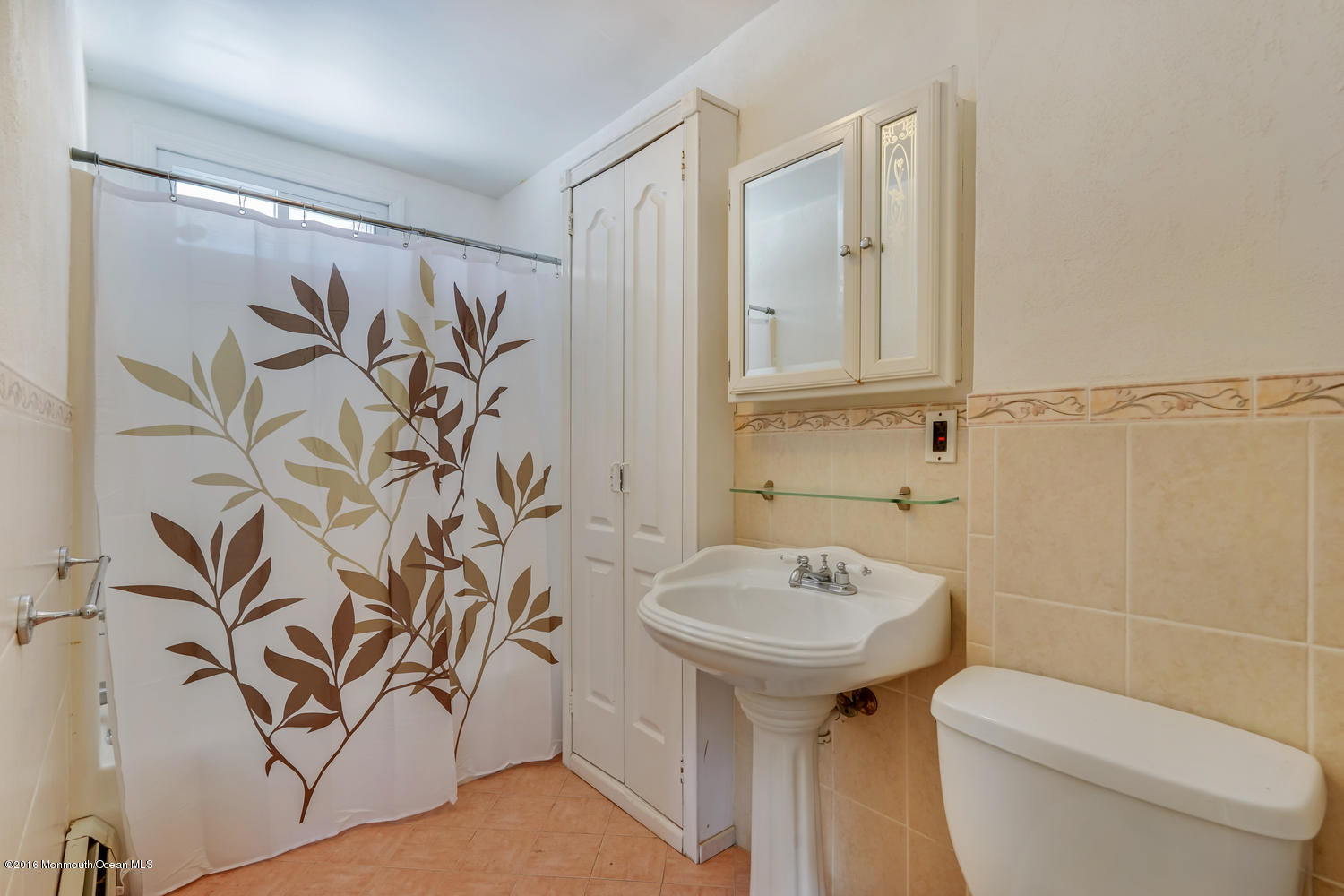 351 Iron Ore Road Manalapan, NJ 07726 - Photo 8 of 20 a bathroom with a sink and mirror with toilet