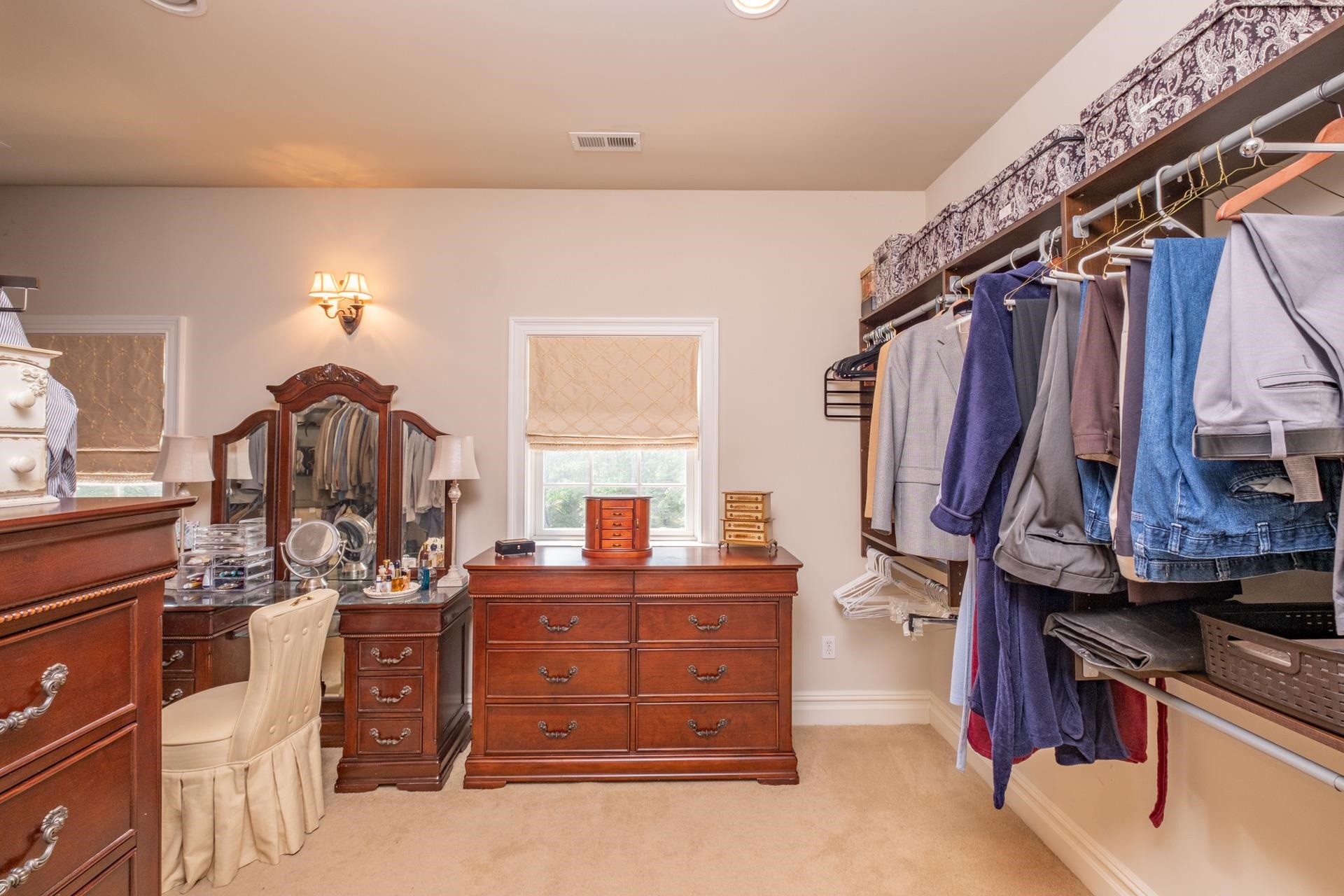 286 Riverside Drive Port Republic, NJ 08241 - Photo 27 of 50 a bedroom with a bed and a chandelier
