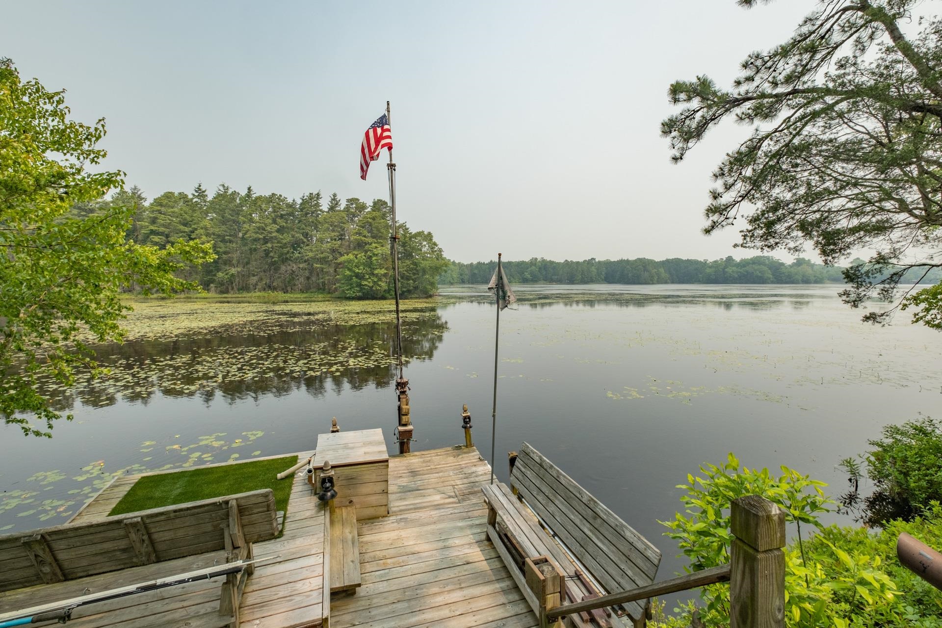 286 Riverside Drive Port Republic, NJ 08241 - Photo 4 of 50 a view of a lake with couches and wooden floor