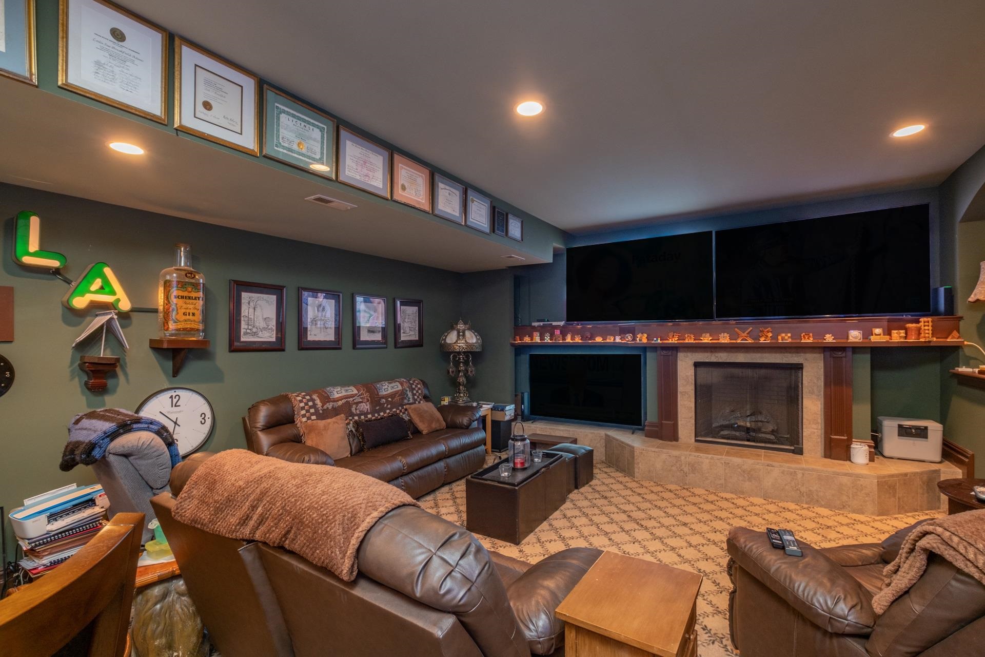 286 Riverside Drive Port Republic, NJ 08241 - Photo 42 of 50 a living room with furniture a fireplace and a flat screen tv