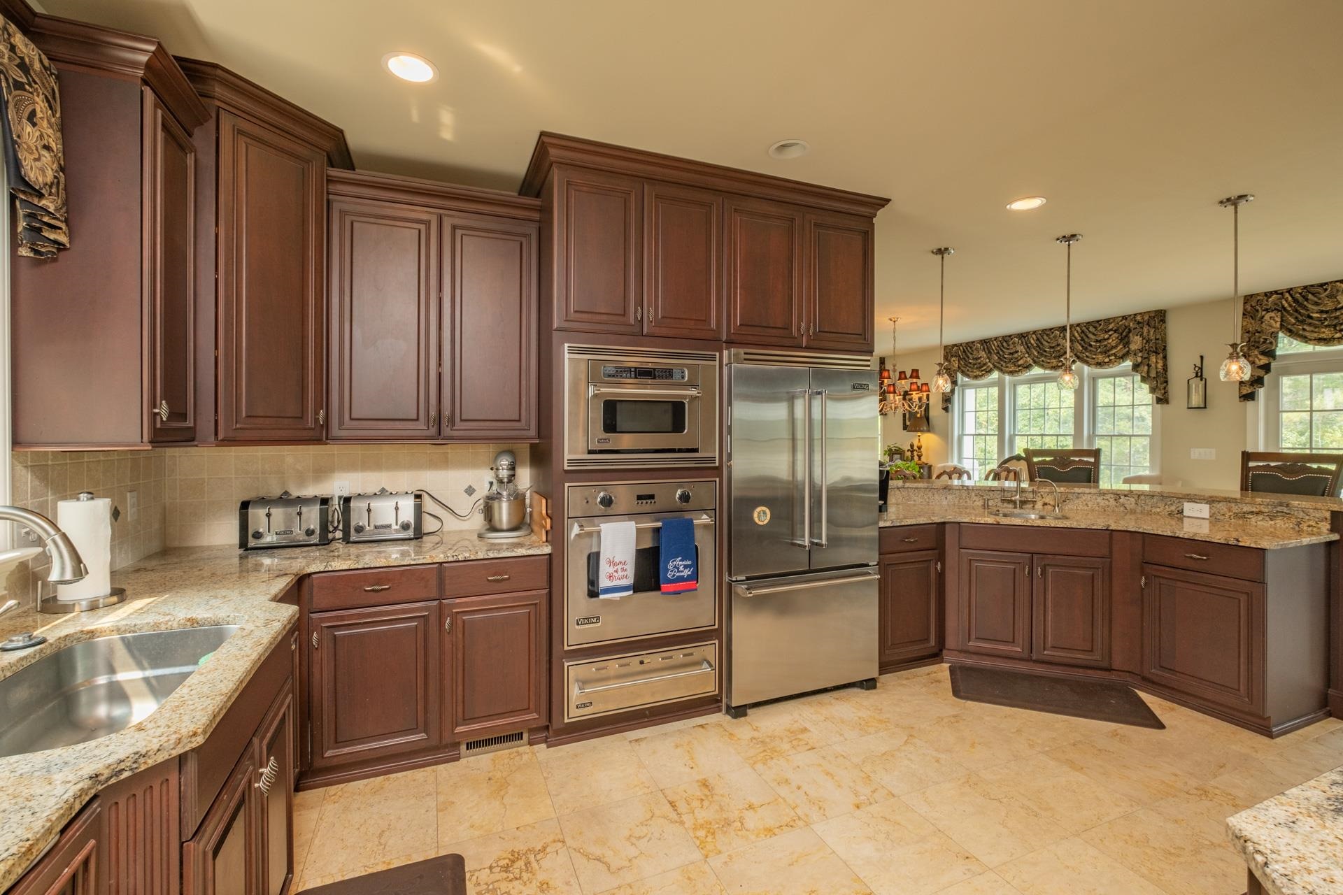 286 Riverside Drive Port Republic, NJ 08241 - Photo 10 of 50 a kitchen with stainless steel appliances granite countertop a sink stove and refrigerator