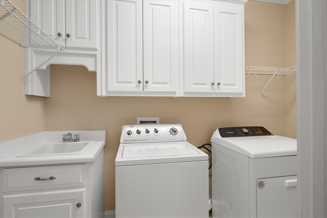 128 Cayman Way Anderson, SC 29621 - Photo 31 of 49 This functional laundry area features ample storage and modern appliances for everyday convenience.