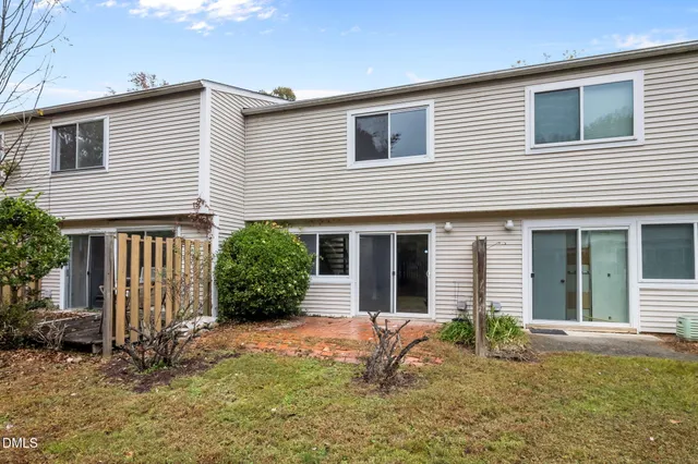 a front view of a house with a yard and porch