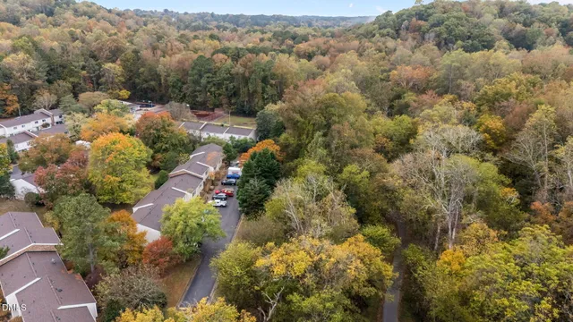 an aerial view of house with yard and mountain view