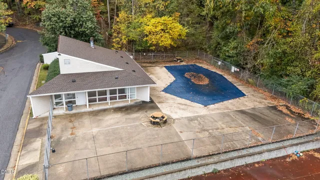 an aerial view of a house with yard