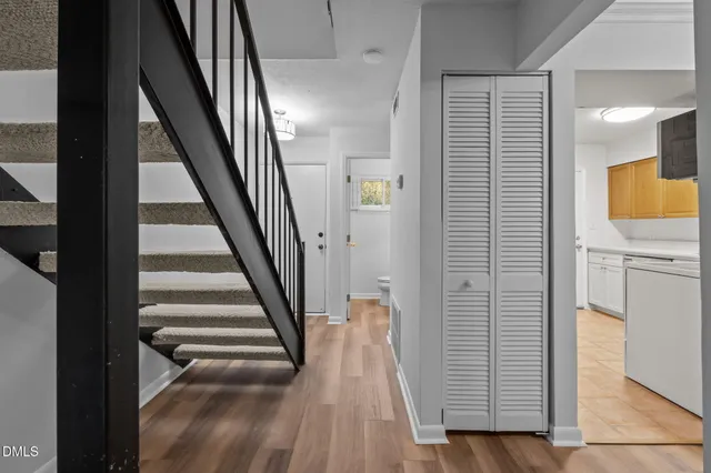 a view of entryway with wooden floor and stairs