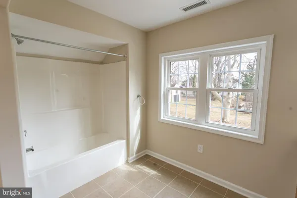 a view of storage and utility room with stairs