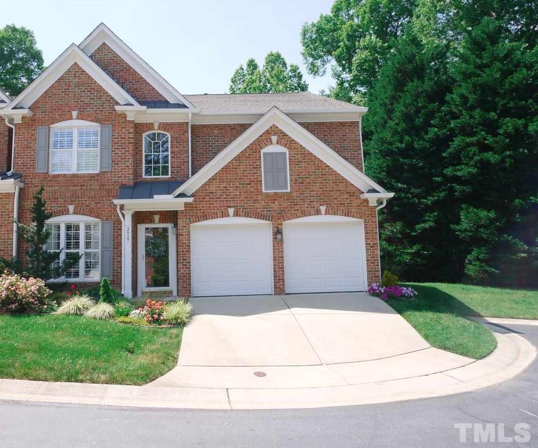 3927 Sunset Maple Court Raleigh, NC 27612 - Photo 1 of 18 a front view of a house with a yard and garage