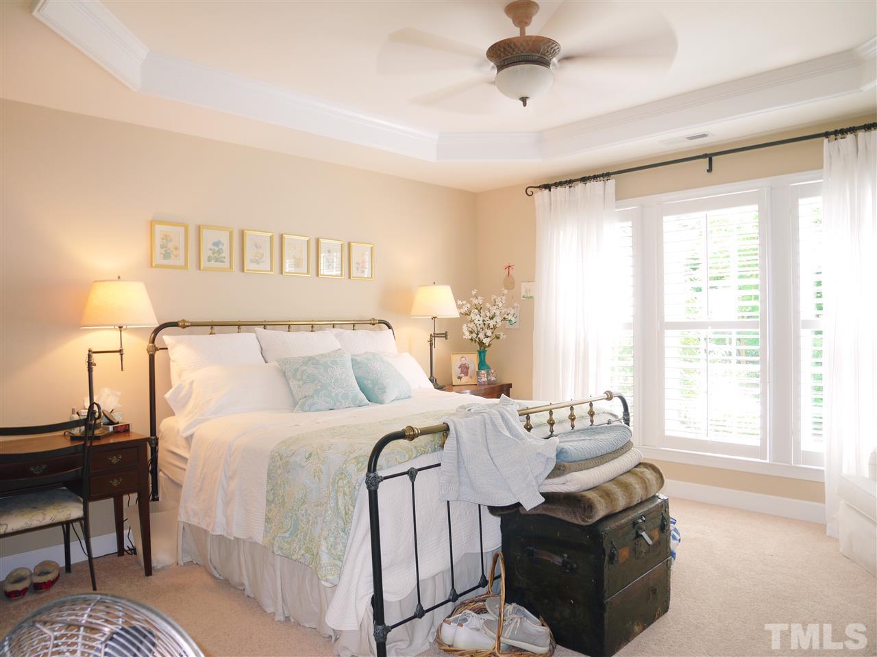 3927 Sunset Maple Court Raleigh, NC 27612 - Photo 11 of 18 a bedroom with a bed and a window