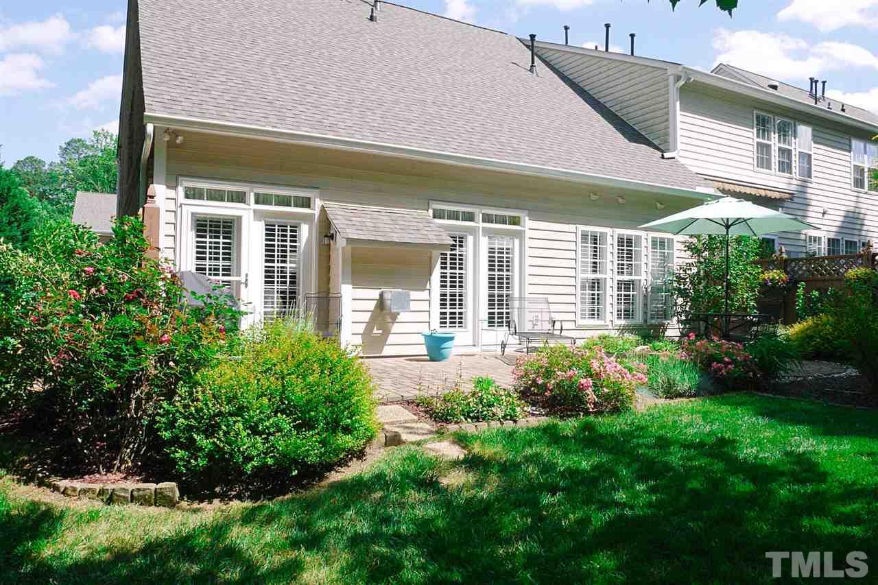 3927 Sunset Maple Court Raleigh, NC 27612 - Photo 17 of 18 a view of a house with a garden