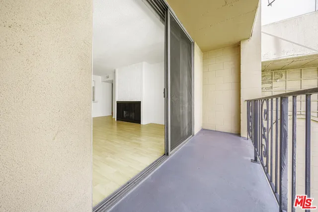 a view of a hallway with a bathroom