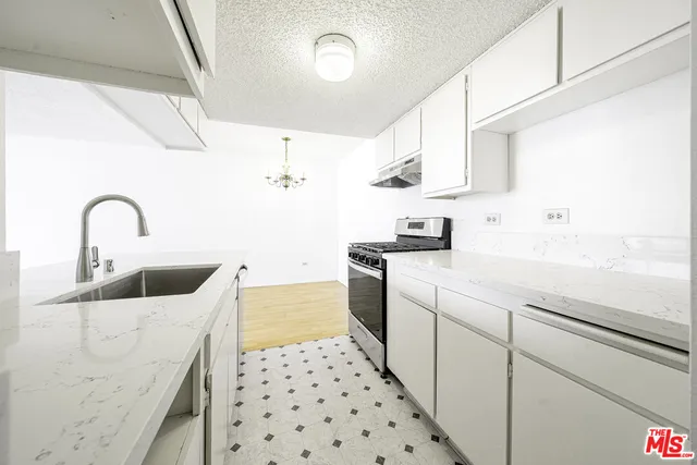 a kitchen with sink cabinets and window