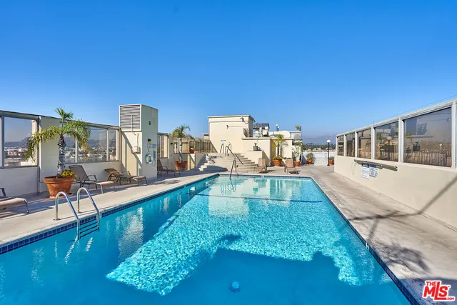 a view of a swimming pool with a deck
