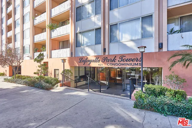 a view of a building with sitting area