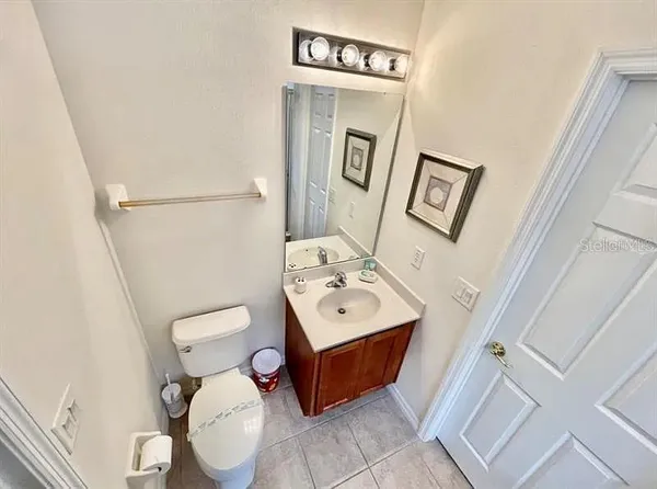 a kitchen with stainless steel appliances a sink a stove a microwave a sink a counter space and cabinets