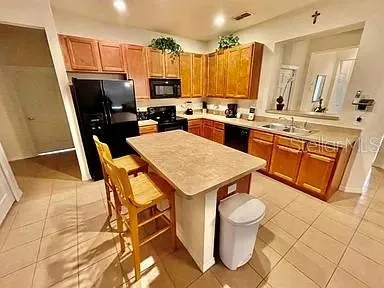 a bed sitting in a bedroom next to a wooden floor