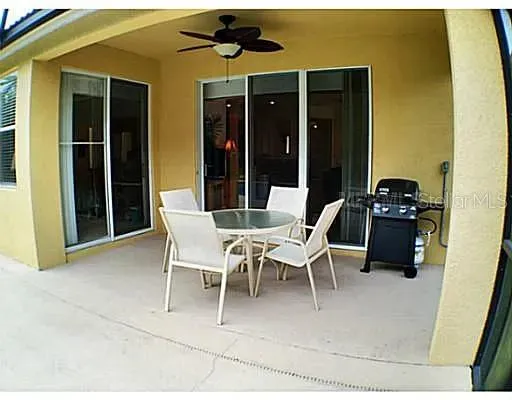 a view of a dining room with furniture and a chandelier