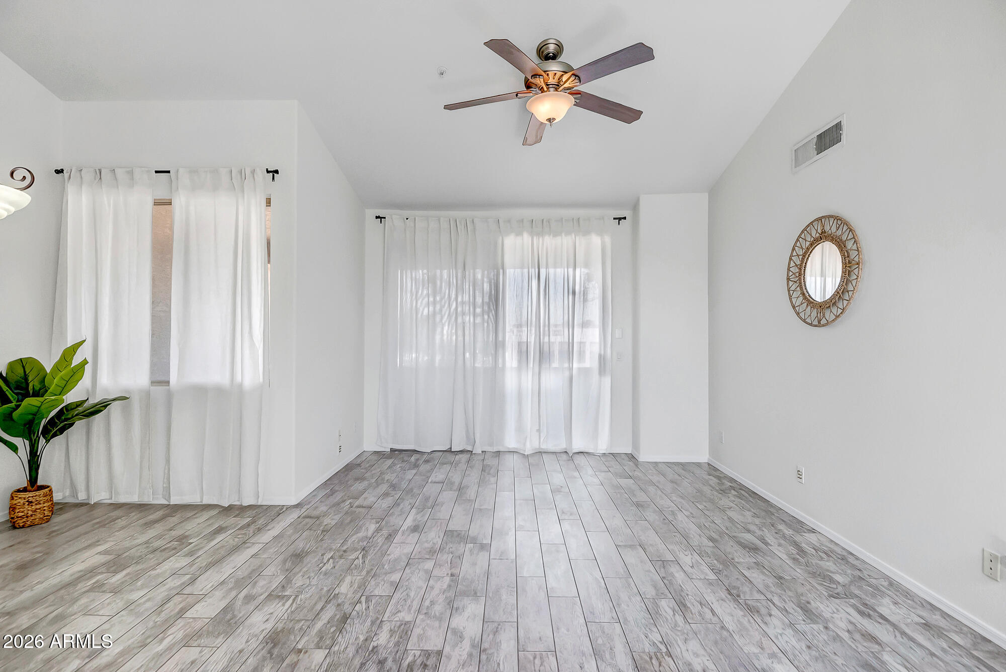 1445 East Broadway Road, Unit 208 Tempe, AZ 85282 - Photo 13 of 29 a view of room with window and hardwood floor