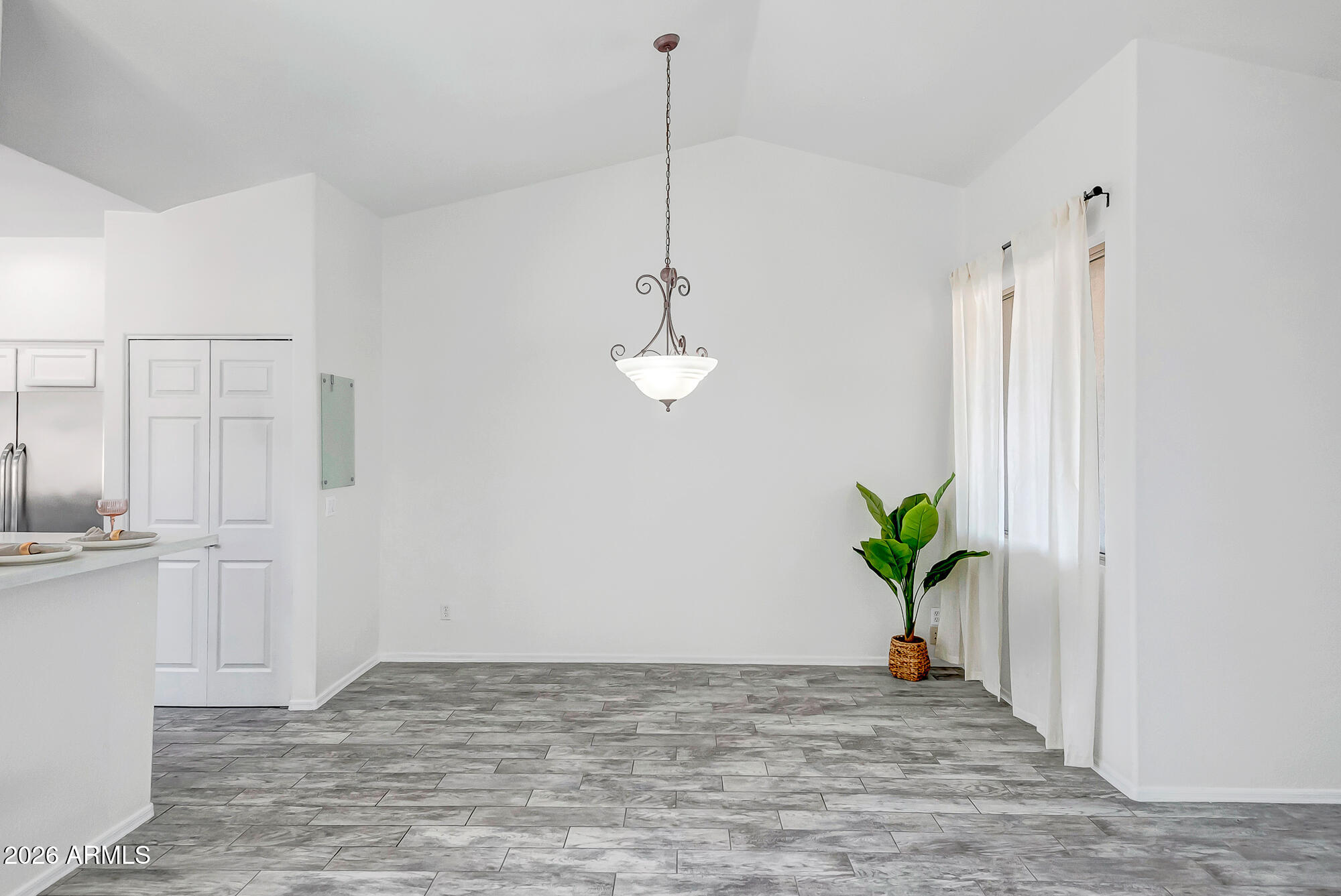 1445 East Broadway Road, Unit 208 Tempe, AZ 85282 - Photo 16 of 29 a view of a kitchen with a sink and natural light