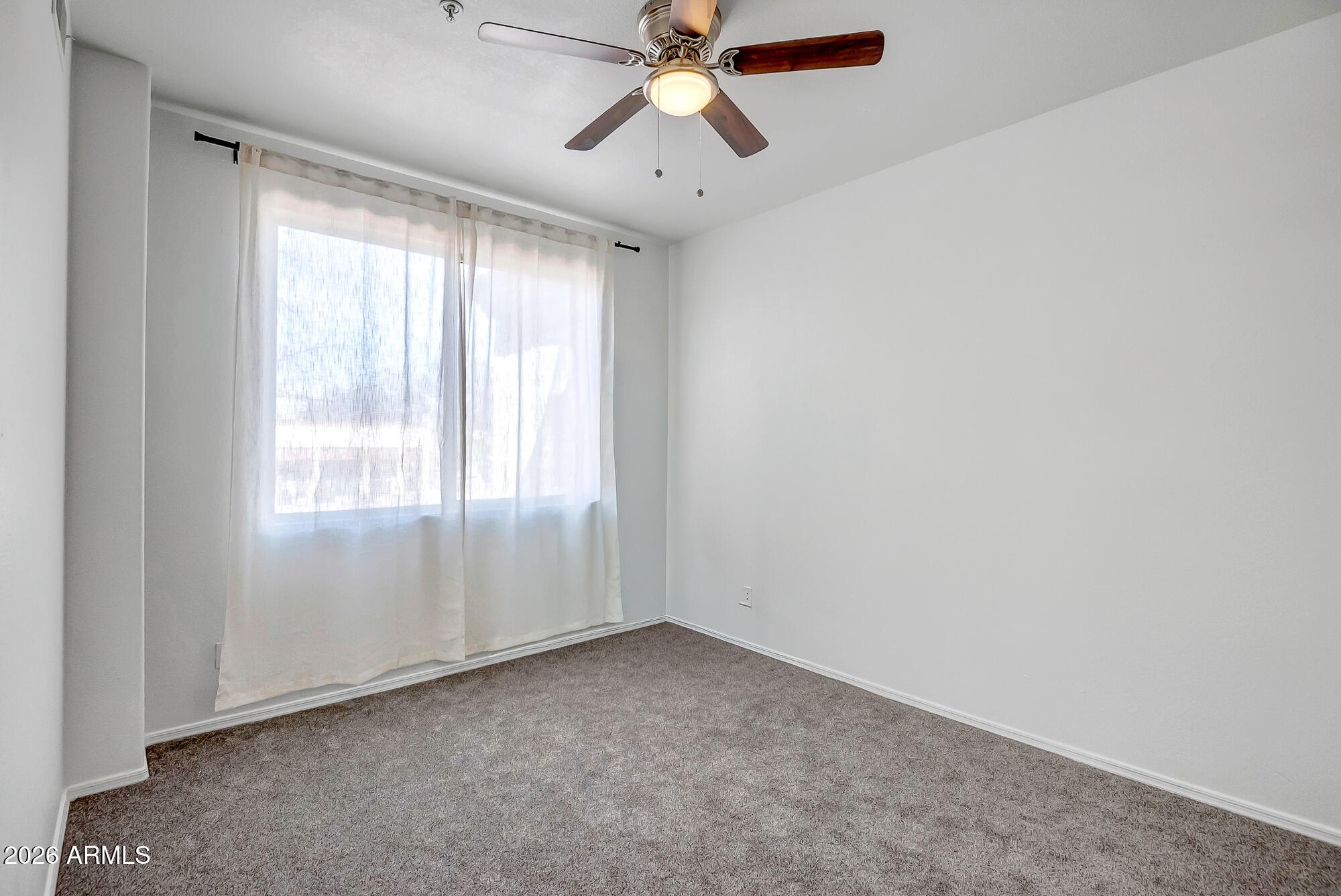 1445 East Broadway Road, Unit 208 Tempe, AZ 85282 - Photo 23 of 29 a view of an empty room and window