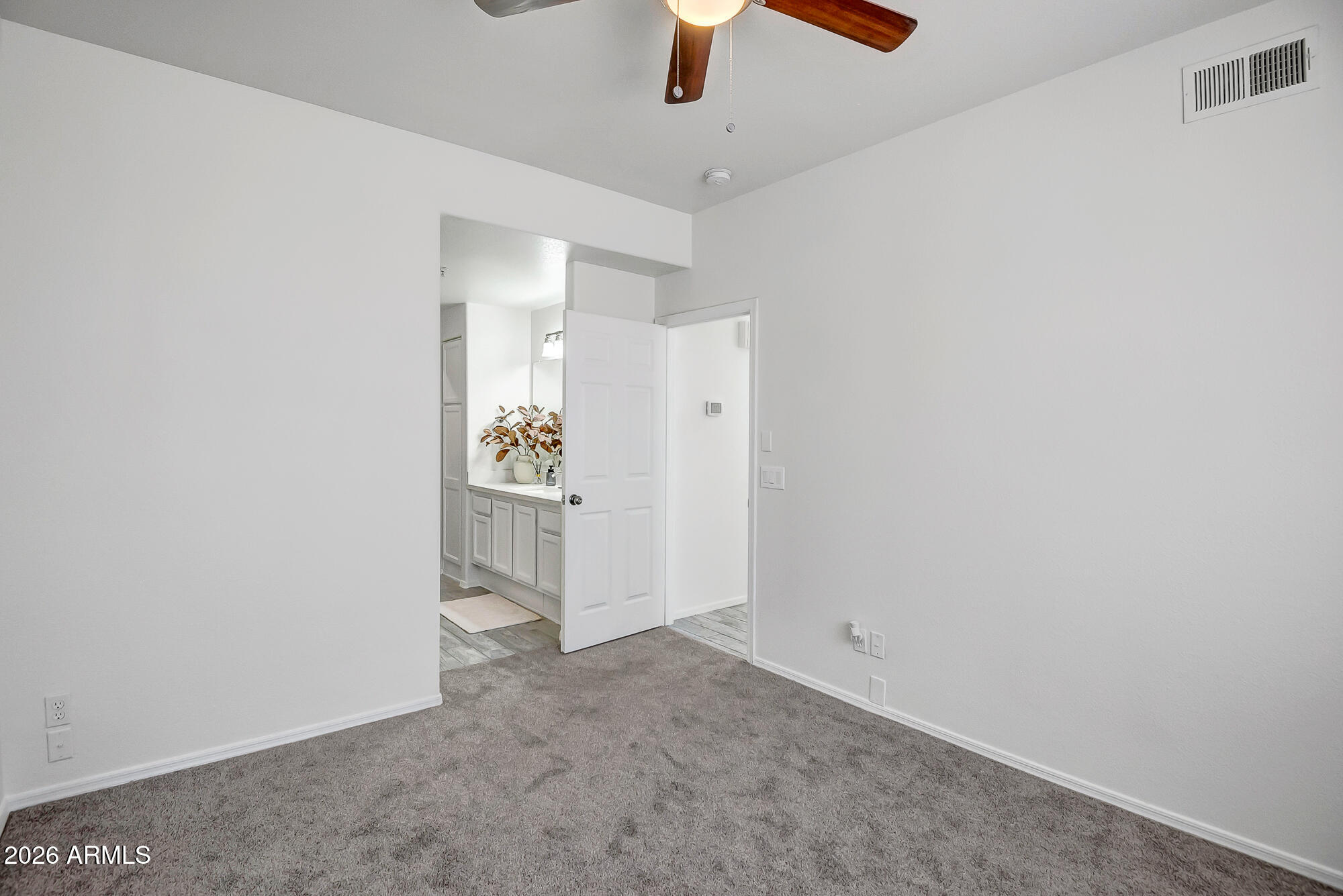 1445 East Broadway Road, Unit 208 Tempe, AZ 85282 - Photo 24 of 29 an empty room with ceiling fan and window