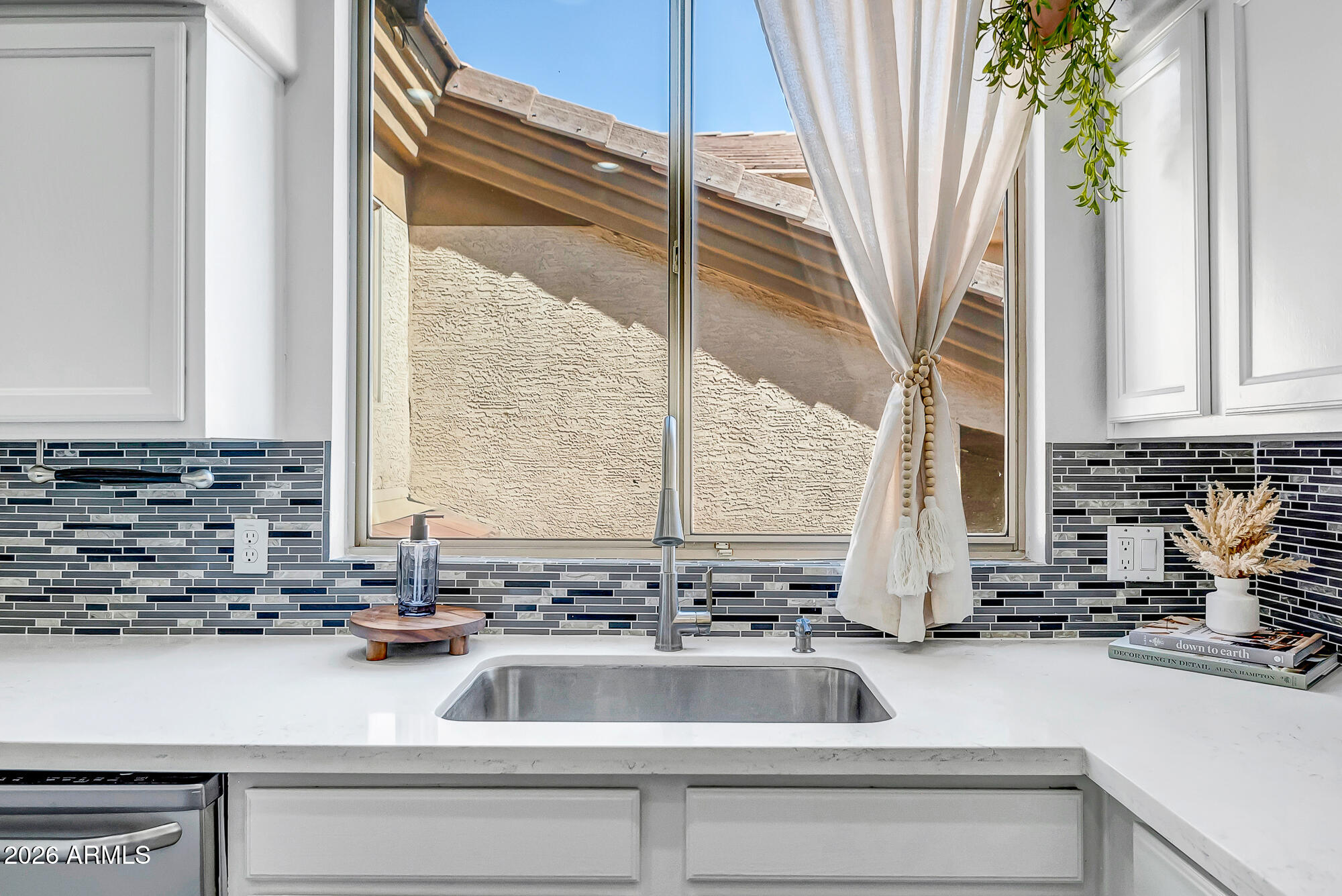 1445 East Broadway Road, Unit 208 Tempe, AZ 85282 - Photo 3 of 29 a kitchen with a sink a counter top space and a potted plant