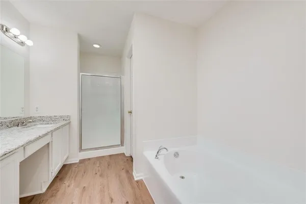 a bathroom with a bathtub and a sink