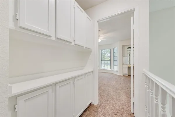 a view of a kitchen cabinets and window