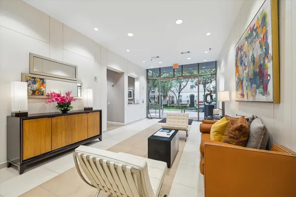 a living room with furniture and a large window