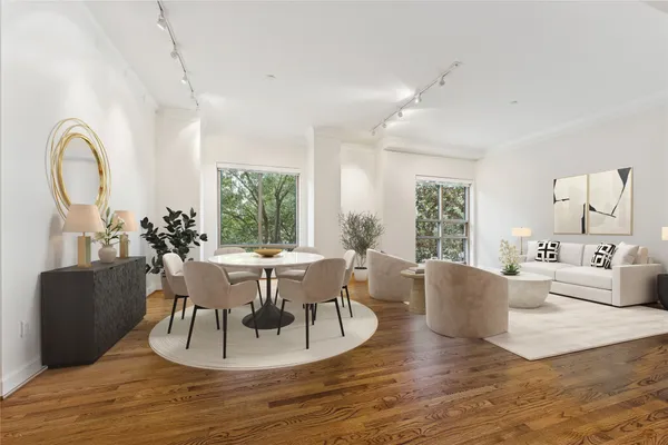 a view of a dining room with furniture window and wooden floor