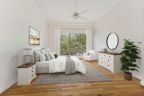 a living room with furniture a fireplace and a large window