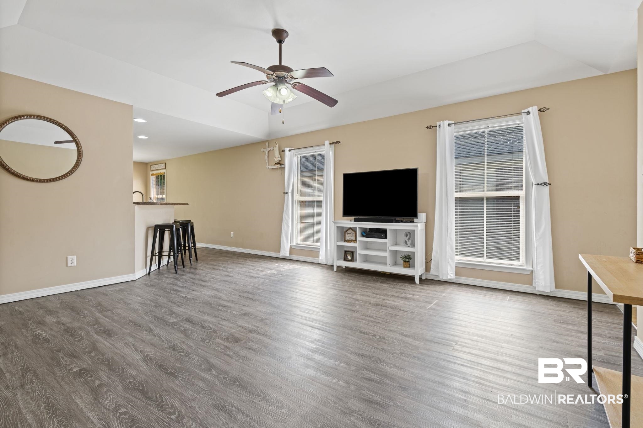 8956 Spring Grove North Mobile, AL 36695 - Photo 4 of 19 Unfurnished living room with a ceiling fan, wood finished floors, plenty of natural light, baseboards, and recessed lighting