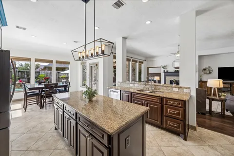 a kitchen with kitchen island granite countertop lots of counter top space