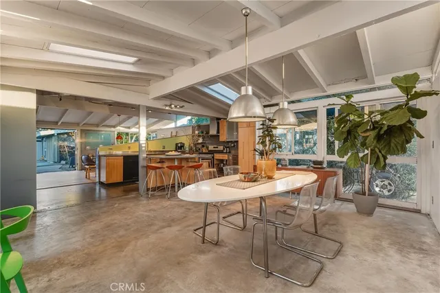 a kitchen with stainless steel appliances kitchen island granite countertop a sink and counter space