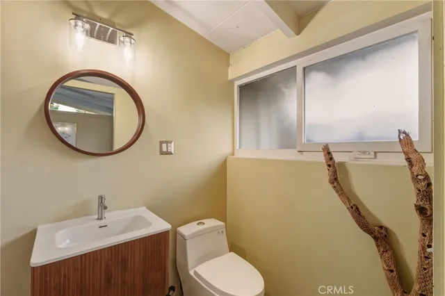 a bedroom with a bed and a night stand