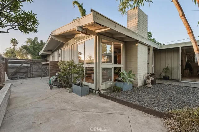 a view of a backyard with sitting area