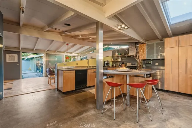 a view of a patio with chair and tables