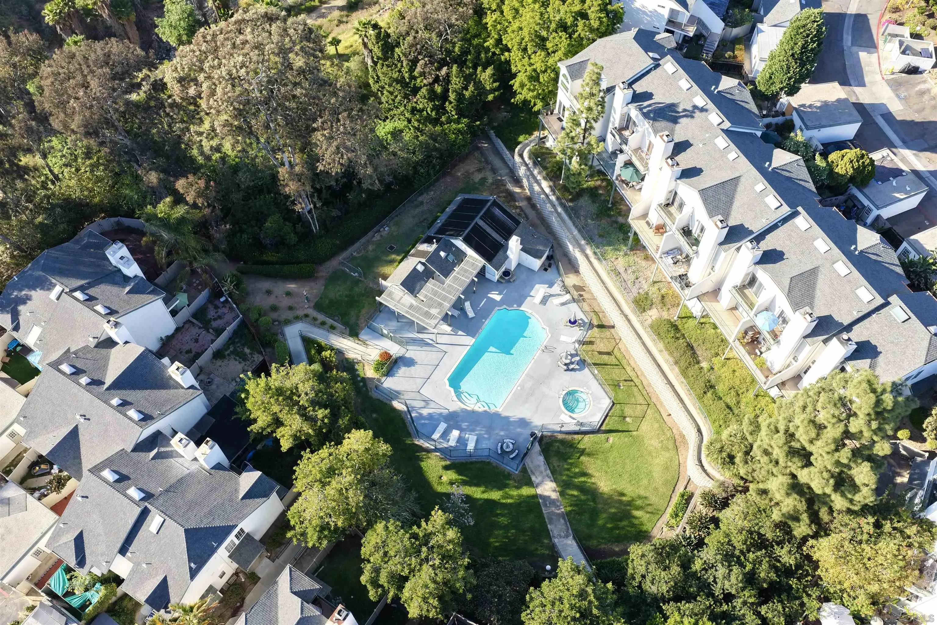 8745 Spring Canyon Drive, Unit 16 Spring Valley, CA 91977 - Photo 5 of 40 an aerial view of a house with a yard and garden