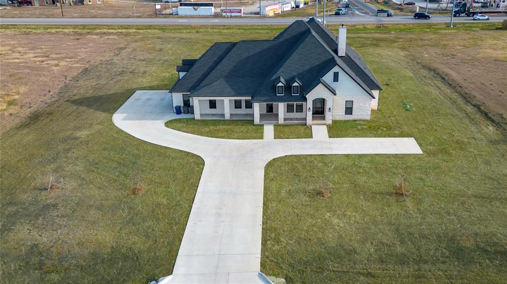 a aerial view of a house with swimming pool